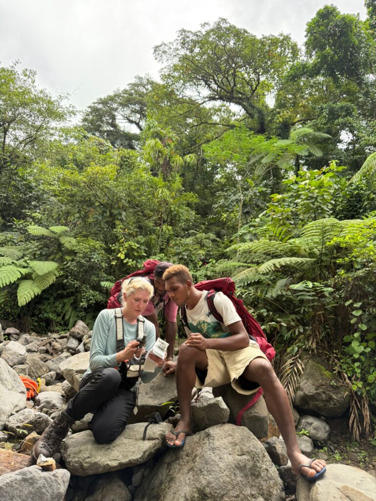 Exploration Manager Krystle Adair Training Locals To Take Rock Samples